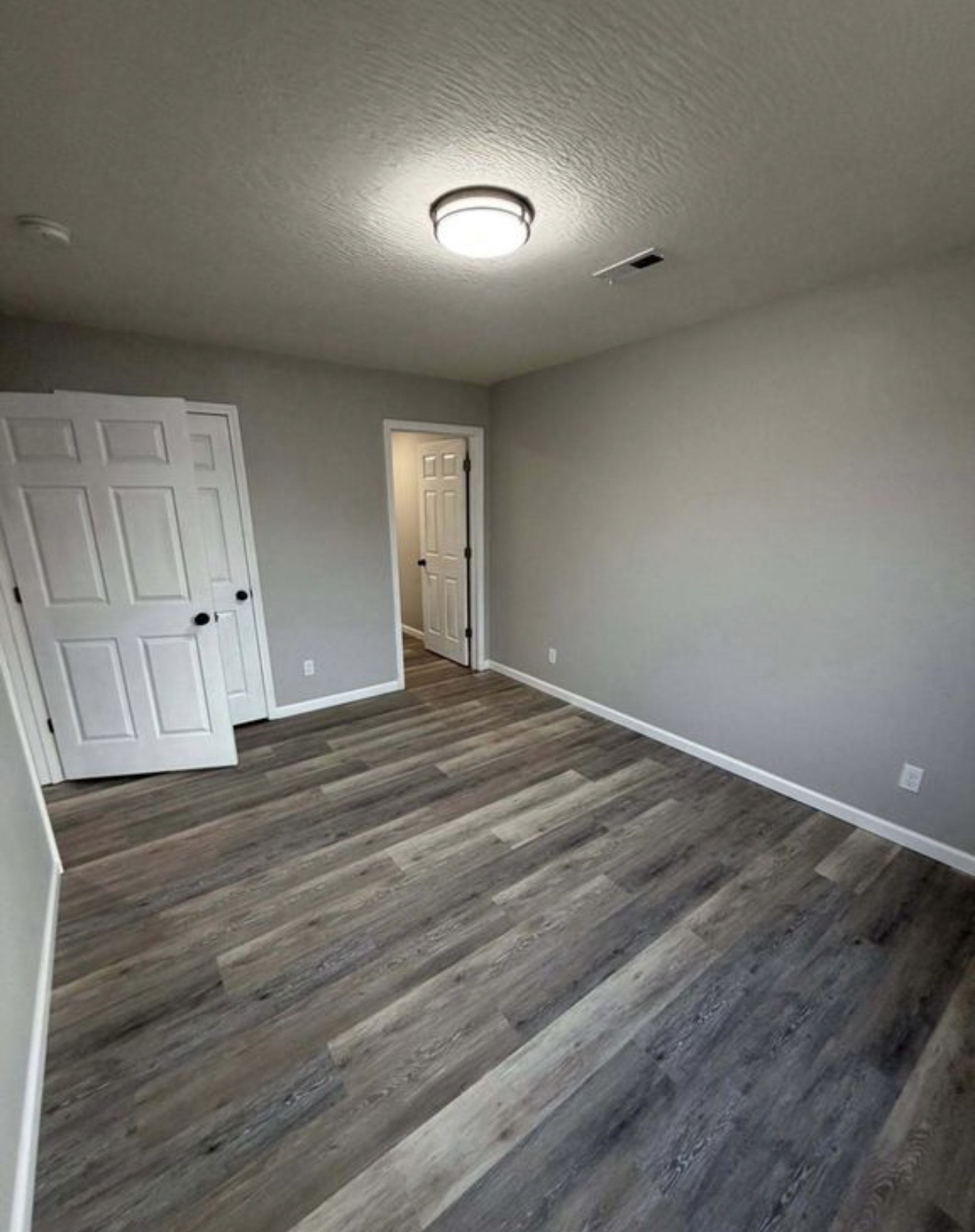 Bedroom with gray flooring